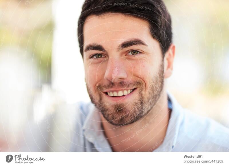 Portrait of smiling young man outdoors smile men males portrait portraits Adults grown-ups grownups adult people persons human being humans human beings