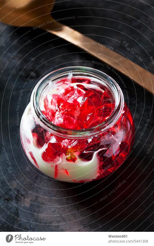 Red fruit jelly in a glass with vanilla sauce nobody currant jelly red ready to eat ready-to-eat studio shot studio shots studio photograph studio photographs