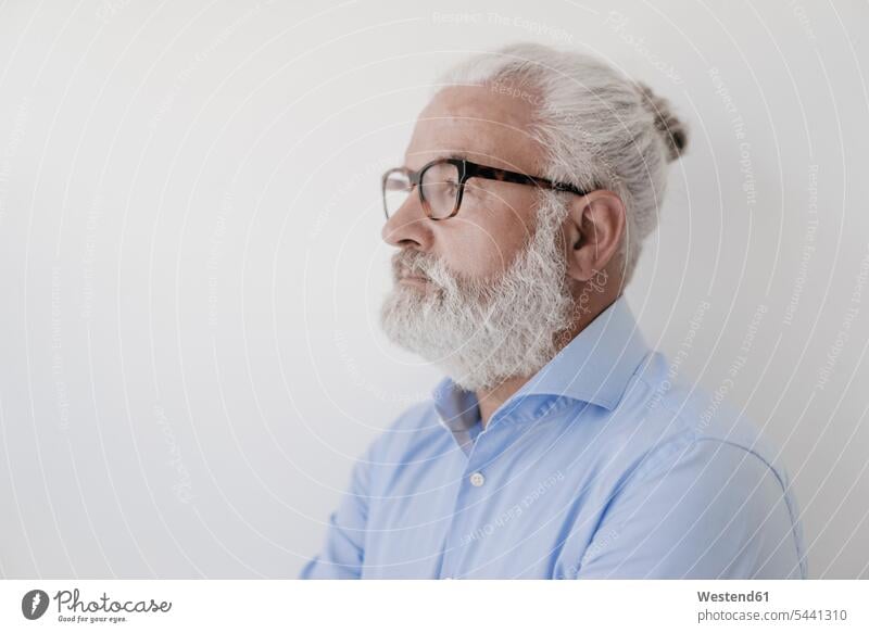 Portrait of serious mature man with beard and glasses portrait portraits Businessman Business man Businessmen Business men males business people businesspeople