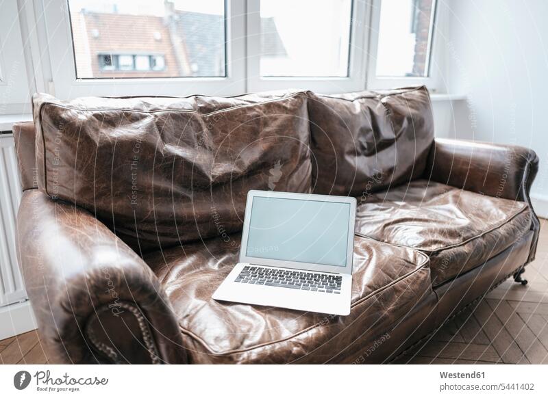 Laptop on couch laptop Laptop Computers laptops notebook computer computers business business world business life Germany Office Offices leather couch