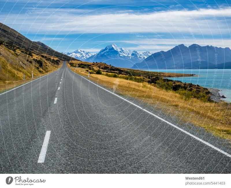 New Zealand, South Island, empty road with Aoraki Mount Cook and Lake Pukaki in the background emptiness mountain mountains rural scene Non Urban Scene