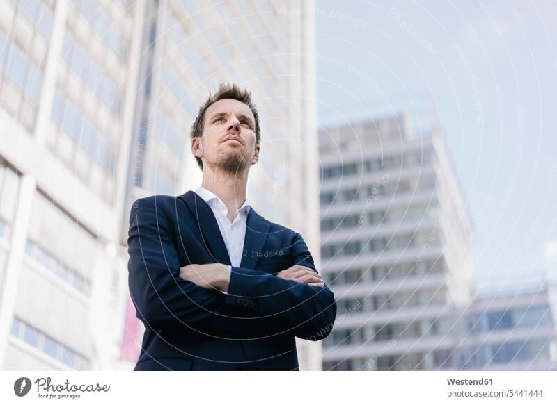 Portrait of confident businessman in the city Businessman Business man Businessmen Business men office building office buildings business people businesspeople