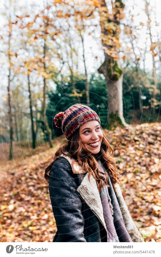 Portrait of a beautiful happy woman in an autumnal forest happiness fall females women portrait portraits woods forests Adults grown-ups grownups adult people
