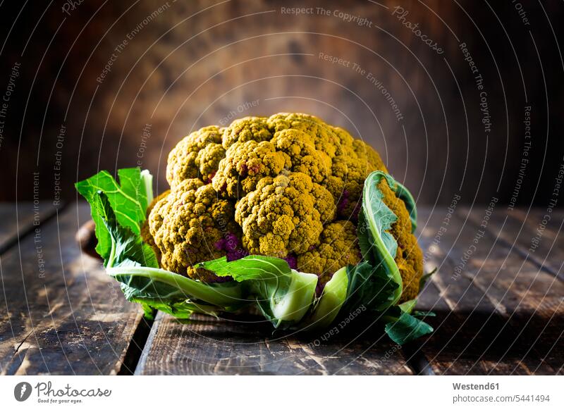 Yellow cauliflower on dark wood food and drink Nutrition Alimentation Food and Drinks old Shabby chic focus on foreground Focus In The Foreground