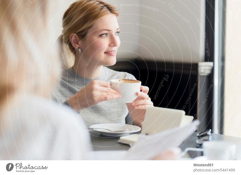 Smiling woman in a cafe Coffee smiling smile businesswoman businesswomen business woman business women Drink beverages Drinks Beverage food and drink Nutrition