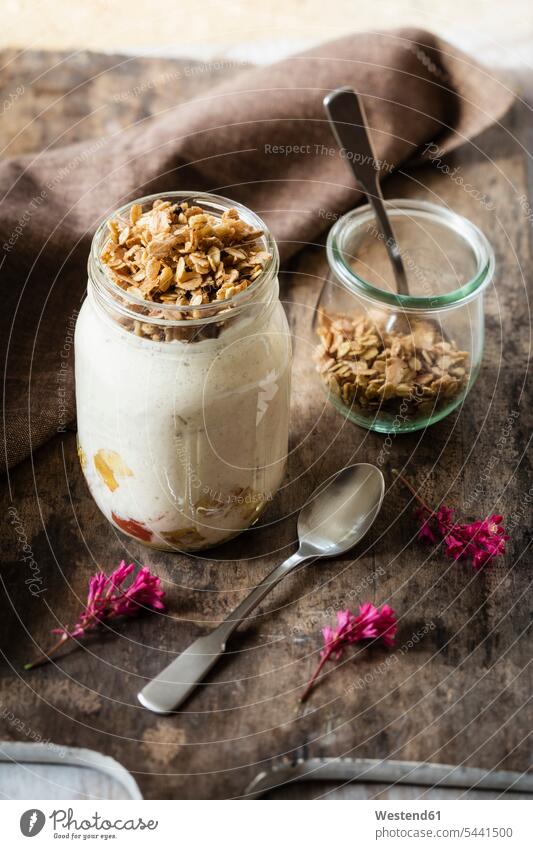 Glass of sauteed apple, natural yoghurt and granola Breakfast crunchy muesli Fruit Fruits Apple Apples sliced garnished prepared ready to eat ready-to-eat
