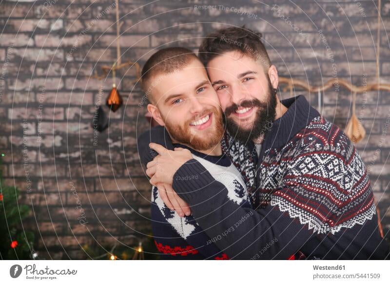 Portrait of happy gay couple embracing at Christmas Gay Couple Gays portrait portraits X-Mas yule Xmas X mas same-sex couple woman and woman women and women