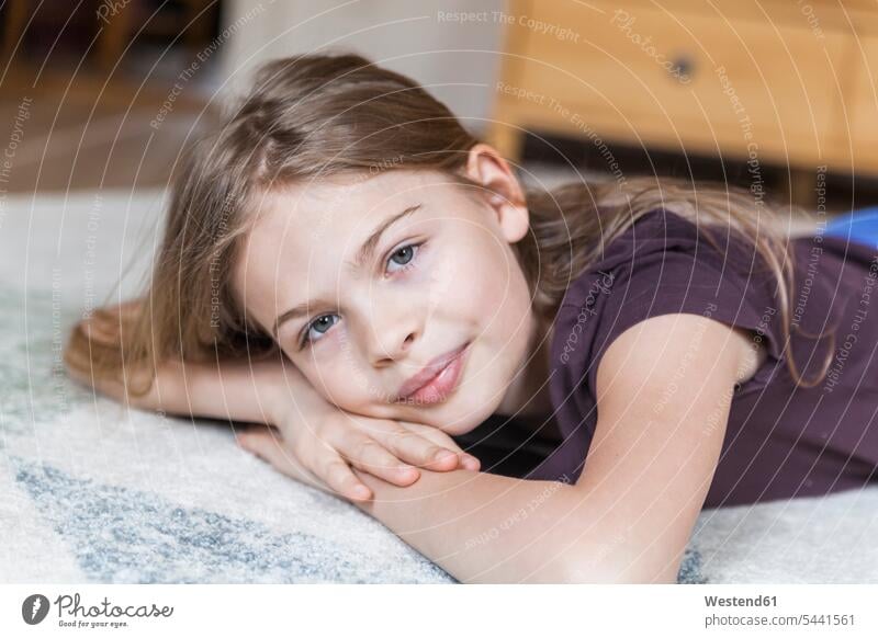 Portrait of girl lying on carpet at home portrait portraits females girls child children kid kids people persons human being humans human beings laying down lie