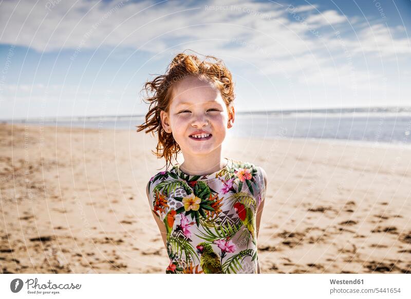 Netherlands, Zandvoort, portrait of redheaded girl on the beach smiling smile portraits red hair red hairs red-haired beaches people persons human being humans