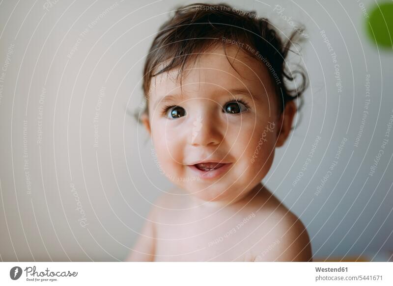 Portrait of happy baby girl smiling smile portrait portraits infants nurselings babies people persons human being humans human beings Spain high spirits