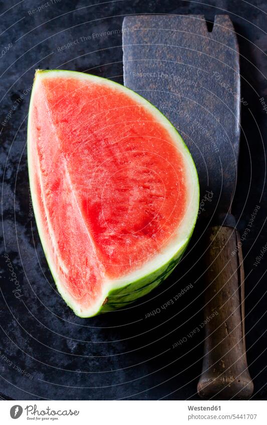 Watermelon on an old cleaver chopping knife chopper cleavers choppers chopping knives studio shot studio shots studio photograph studio photographs