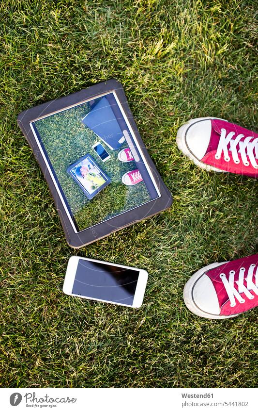 Smartphone, tablet with photography and feet in grass digitizer Tablet Computer Tablet PC Tablet Computers iPad Digital Tablet digital tablets foot human foot