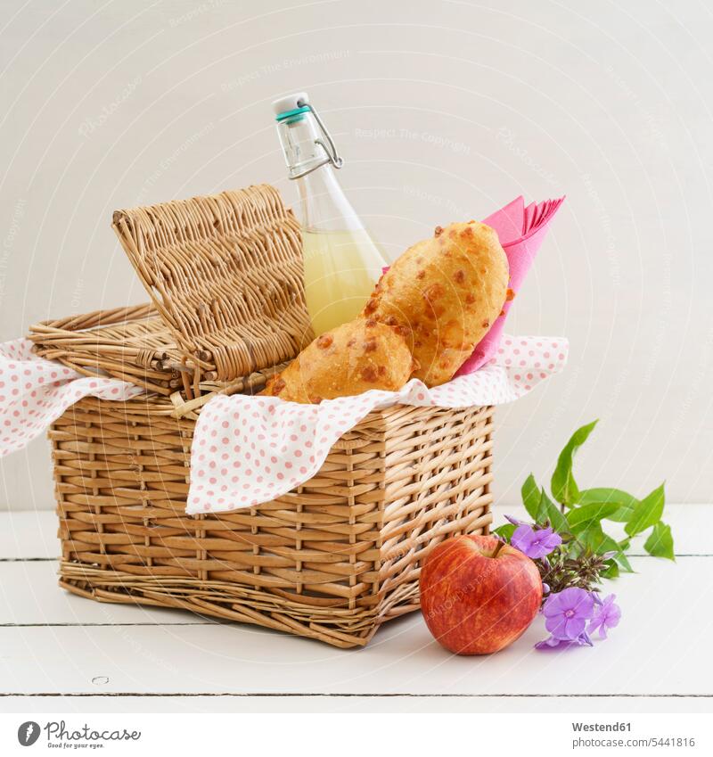Picnic basket with cheese baguettes and fruit juice food and drink Nutrition Alimentation Food and Drinks Flower Flowers wickerbasket wicker basket