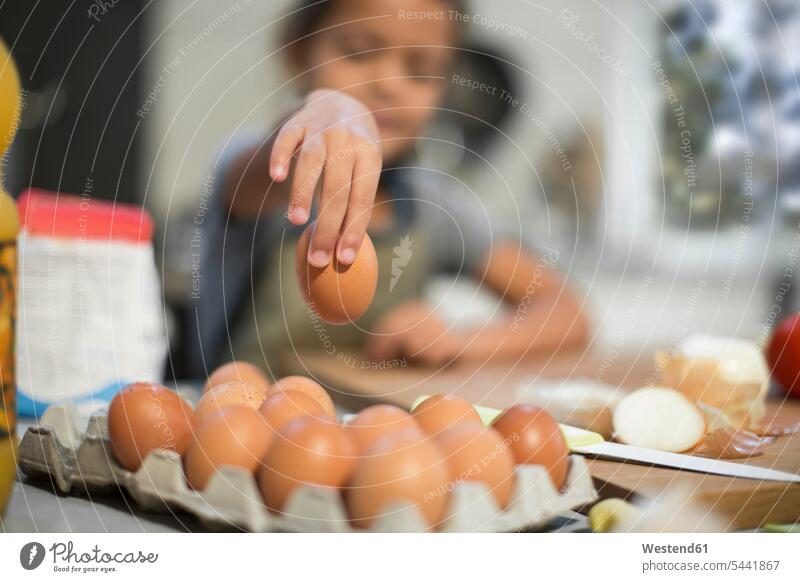 Girl in kitchen taking egg Egg Eggs girl females girls domestic kitchen kitchens Food foods food and drink Nutrition Alimentation Food and Drinks child children