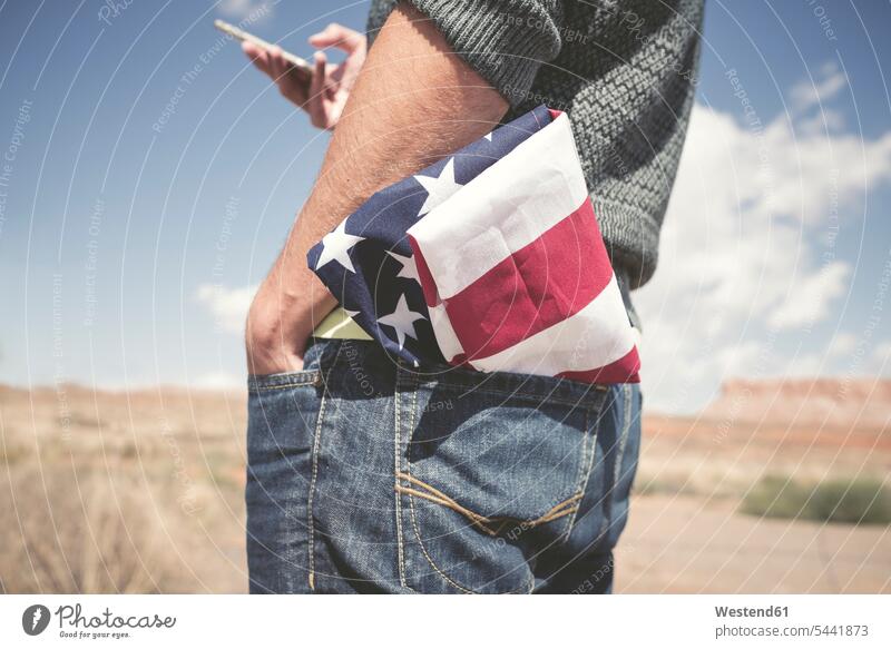 USA, Utah, man with American Flag in his pocket, partial view American Flags Flag of America Stars And Stripes Star-Spangled Banner men males Adults grown-ups