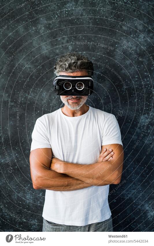 Mature man looking through VR glasses backwards portrait portraits mature men mature man Looking Through Object Looking Through an Object back to front