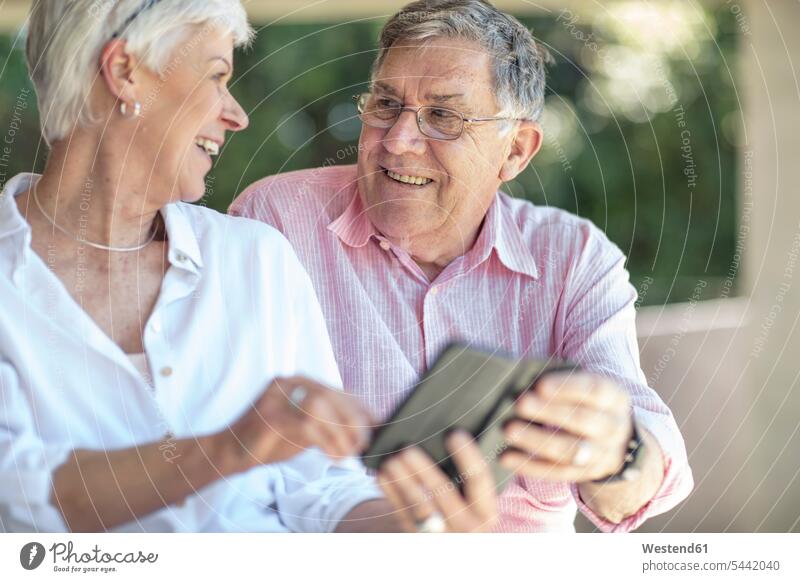 Happy senior couple looking at each other happiness happy senior men senior man elder man elder men senior citizen twosomes partnership couples together home