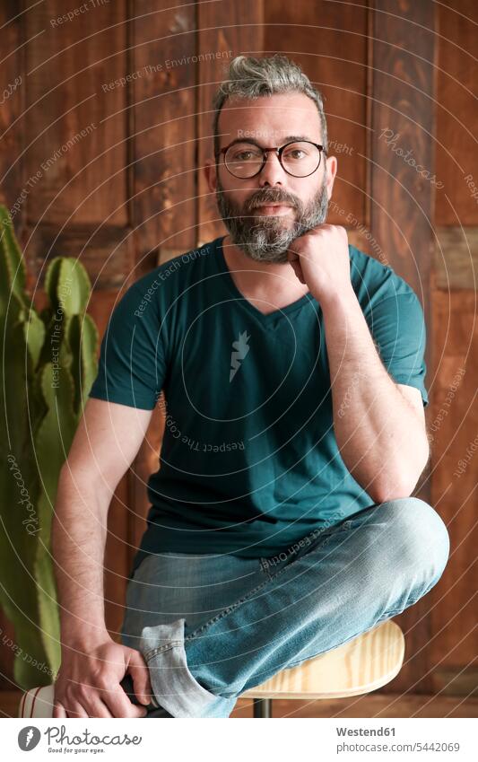Portrait of bearded man wearing glasses men males portrait portraits Adults grown-ups grownups adult people persons human being humans human beings specs