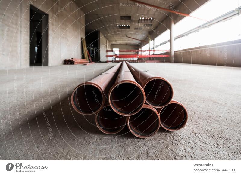 Pipes in an unfinished building under construction Absence Absent lying laying down lie lying down built structure buildings built structures