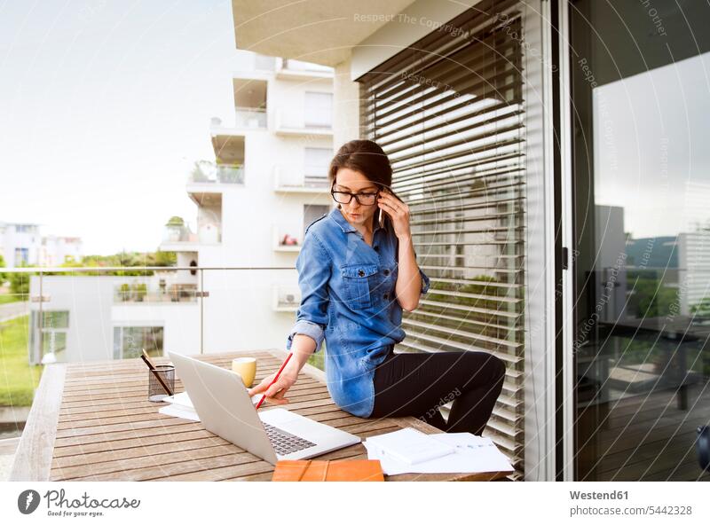 Businesswoman on the phone working on balcony at home freelancer freelancing home office working from home home business call telephoning On The Telephone