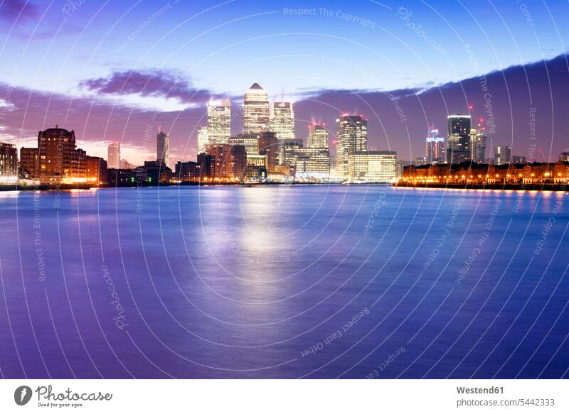 UK, London, skyline with Canary Wharf skyscrapers at dawn illuminated lit lighted Illuminating morning light View Vista Look-Out outlook cloudy cloudiness