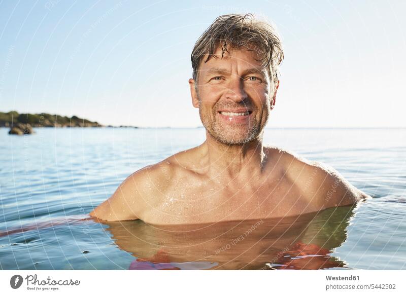 Portrait of smiling man bathing in the sea Sea ocean men males water Adults grown-ups grownups adult people persons human being humans human beings