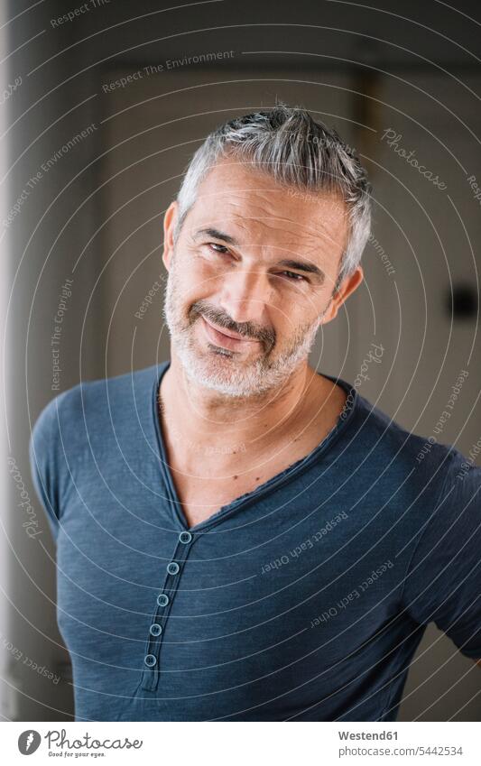 Portrait of smiling mature man at home smile men males portrait portraits Adults grown-ups grownups adult people persons human being humans human beings