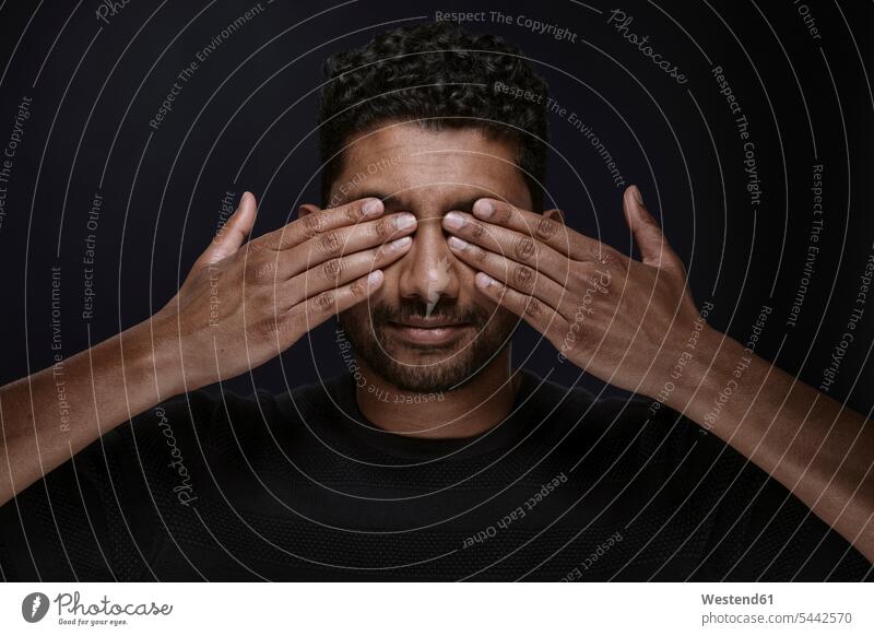 Portrait of man covering eyes with his hands men males portrait portraits Adults grown-ups grownups adult people persons human being humans human beings
