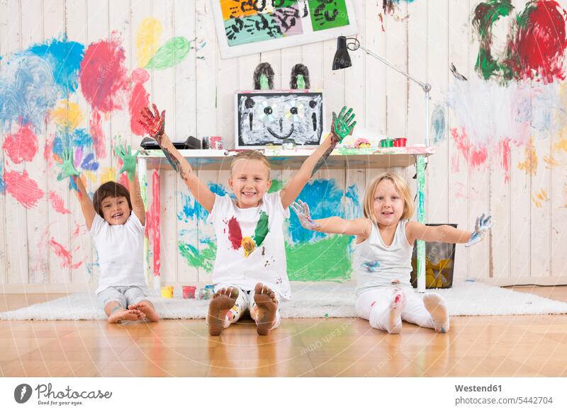 Three girls painting office with finger paint multi-coloured multicoloured multi colored Multi Coloured colorful fingerpainting finger paints offices