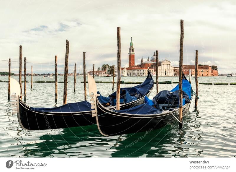 Italy, Venice, gondolas in front of San Giorgio Maggiore cloud clouds outdoors outdoor shots location shot location shots Architecture wooden stake