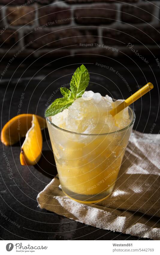 Orange granita Glass Drinking Glasses enjoyment indulgence frozen prepared delicacy specialty specialties fruit garnished sliced ready to eat ready-to-eat