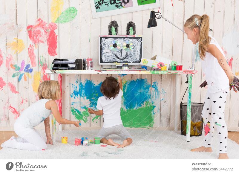 Three girls painting office with finger paint multi-coloured multicoloured multi colored Multi Coloured colorful offices office room office rooms fingerpainting
