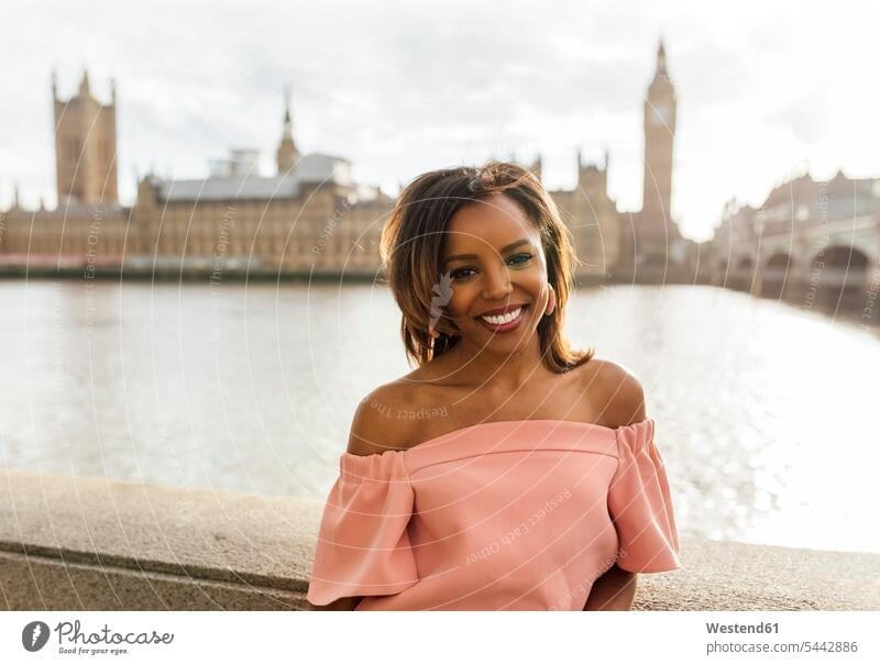 UK, London, portrait of a beautiful woman near Palace of Westminster females women portraits smiling smile Adults grown-ups grownups adult people persons