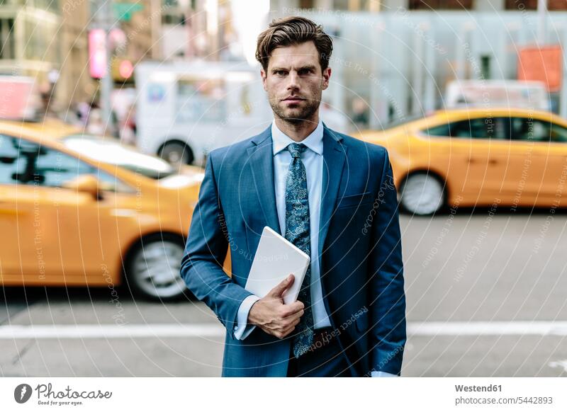 Handsome businessman walking in Manhattan, carrying digital tablet attractive beautiful pretty good-looking Attractiveness going digitizer Tablet Computer