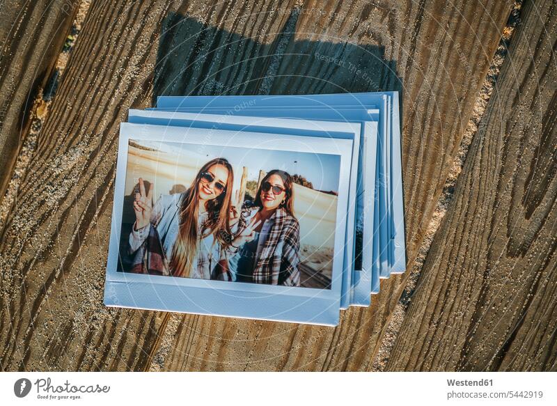 Stack of instant photos of two best friends photograph photographs instant photography polaroid polaroids image images picture pictures woman females women