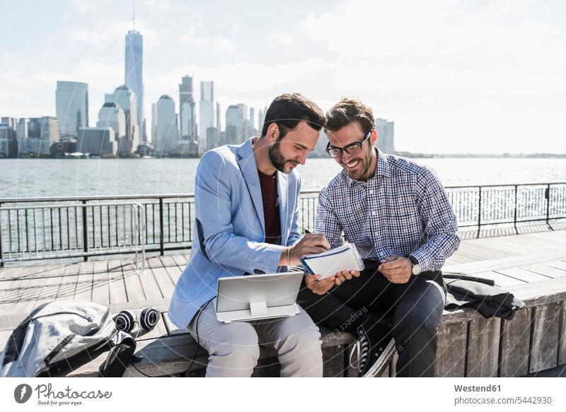 USA, two businessmen working at New Jersey waterfront with view to Manhattan tablet digitizer Tablet Computer Tablet PC Tablet Computers iPad Digital Tablet