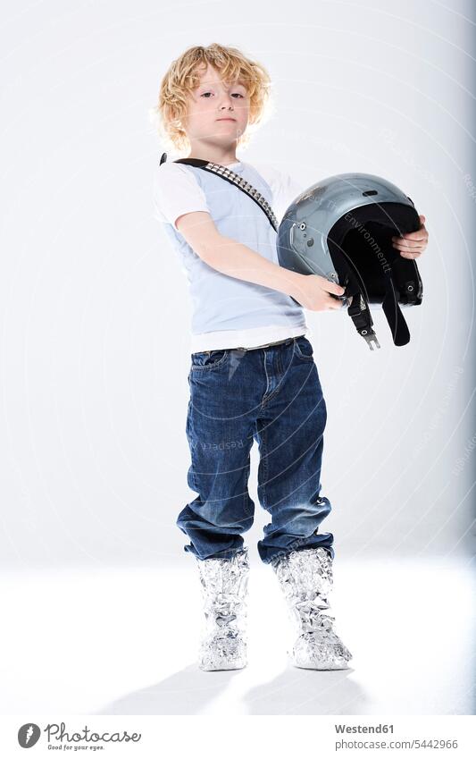 Portrait of a boy dressed up as spaceman boys males astronaut astronauts helmet helmets Protective Headwear playing child children kid kids people persons