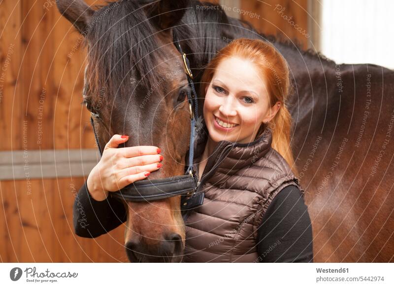 Portrait of happy young woman with her horse females women equus caballus horses portrait portraits Adults grown-ups grownups adult people persons human being