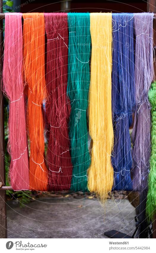 Thailand, Bangkok, colorful silk fiber hanging outside traditional culture Tradition Traditions production fabrication productions Bright Colour vibrant color