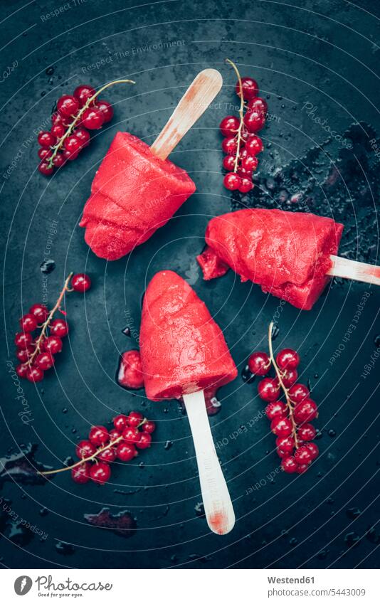 Homemade currant popsicles and red currants on slate sweet Sugary sweets fruity sorbet sorbets Dessert Afters Desserts currant ice cream redcurrant Redcurrants