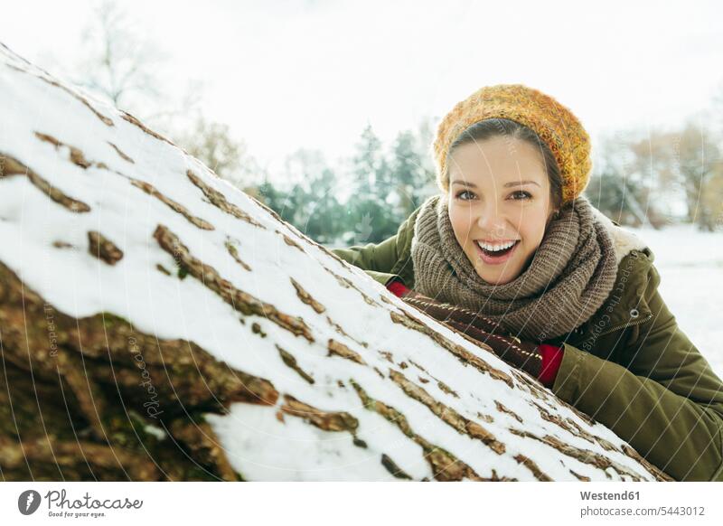 Portrait of laughing woman in the snow females women portrait portraits Adults grown-ups grownups adult people persons human being humans human beings weather