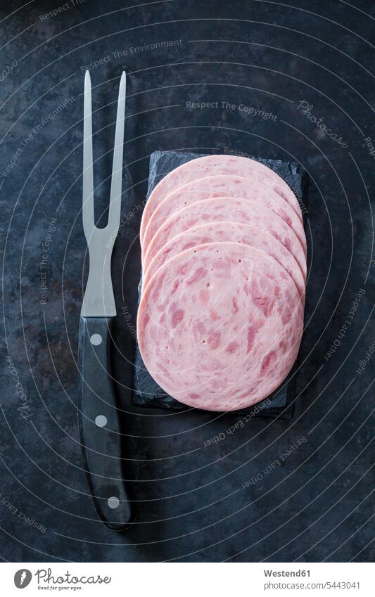 Sliced ham sausage with meat fork overhead view from above top view Overhead Overhead Shot View From Above sliced Slices Sausage Sausages Fork Forks cold cuts
