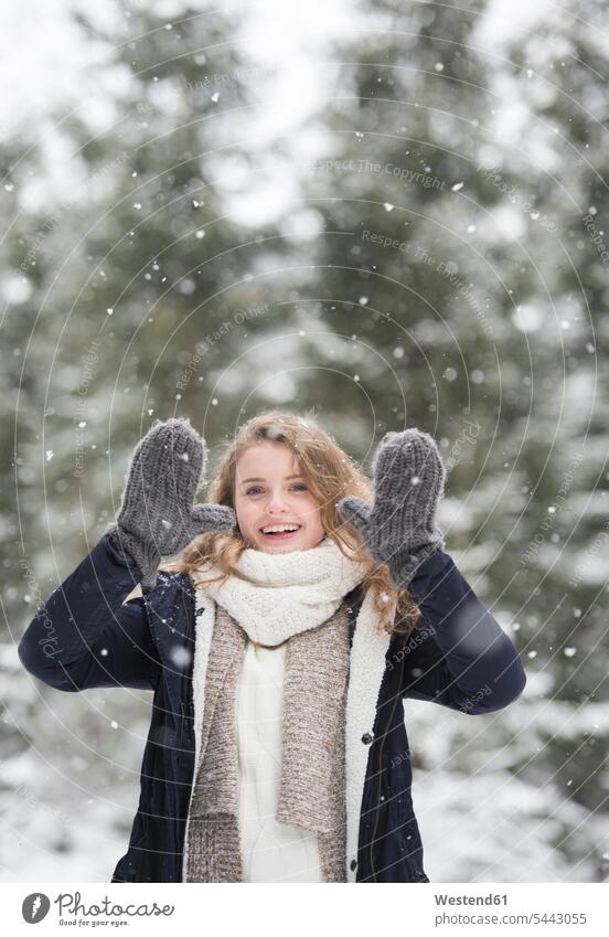 Portrait of happy young woman at snowfall in nature portrait portraits females women Adults grown-ups grownups adult people persons human being humans