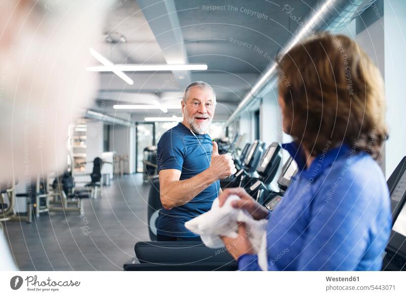 Group of fit seniors on treadmills working out in gym senior adults old exercising exercise training practising gyms Health Club Adults grown-ups grownups