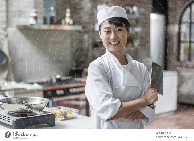 Portrait of smiling female chef in kitchen female cook restaurant restaurants Cooking Pot Pots Cooking Pots smile cooks Chefs Dishes Crockery Tableware