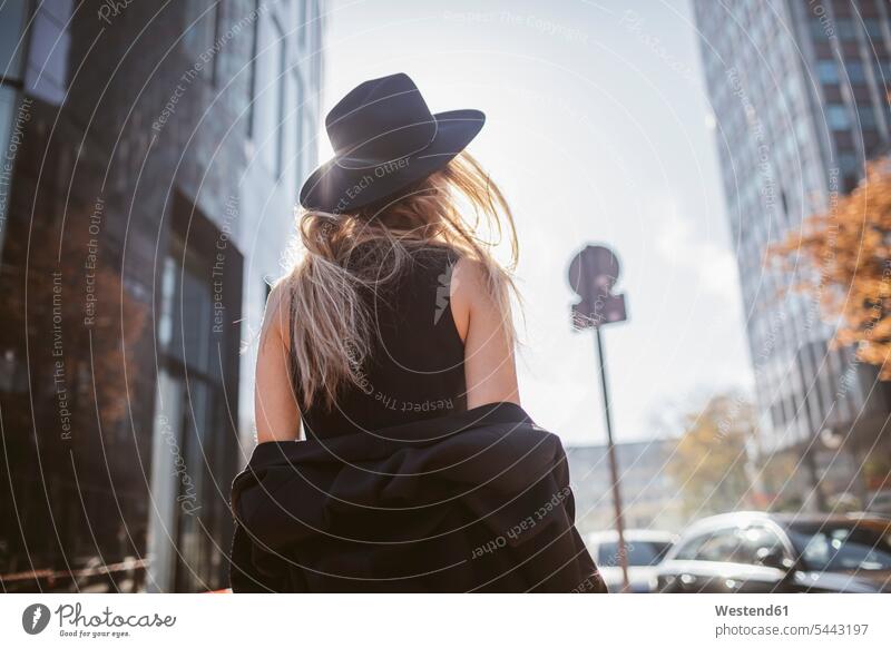 Back view of woman with hat dressed in black hats females women colour colours Adults grown-ups grownups adult people persons human being humans human beings