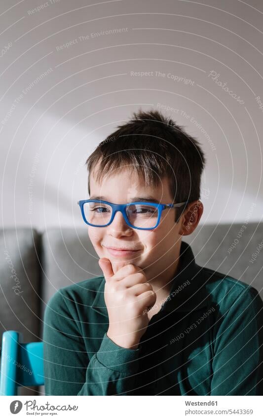 Portrait of smiling boy wearing blue glasses boys males smile specs Eye Glasses spectacles Eyeglasses portrait portraits child children kid kids people persons