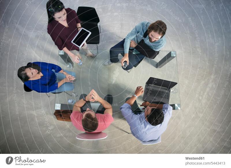 Top view of casual businesspeople having a meeting office offices office room office rooms workplace work place place of work Business Meeting