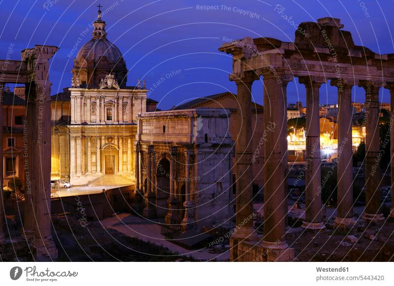 Italy, Rome, Temple of Vespasian and Titus and Church of Santi Luca e Martina at Forum Romanum at night illuminated lit lighted Illuminating Roman Forum