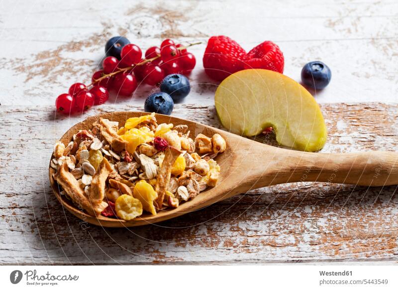 Wooden spoon of granola with dried fruits and fresh fruits on wood nobody fruit muesli Oat Flakes rolled oats Raspberry Raspberries Shabby chic Fruit Fruits
